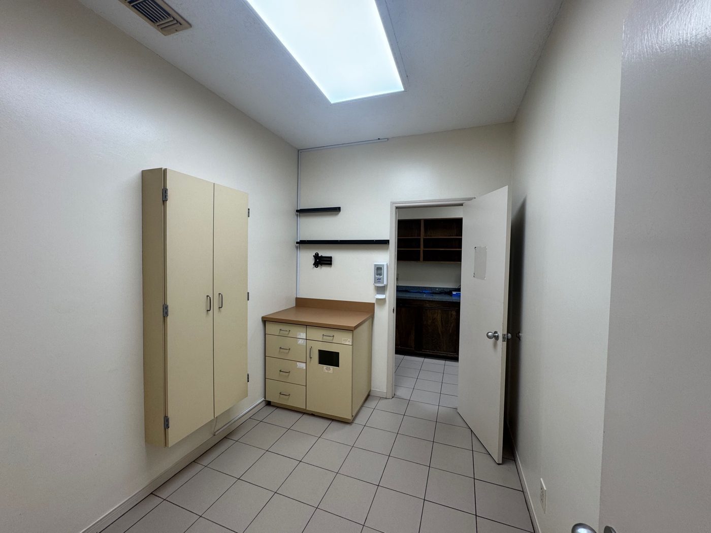 Exam room with wall-mounted folding table